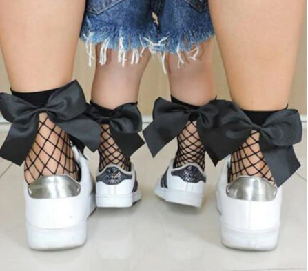 Fishnet socks: Black with bow back